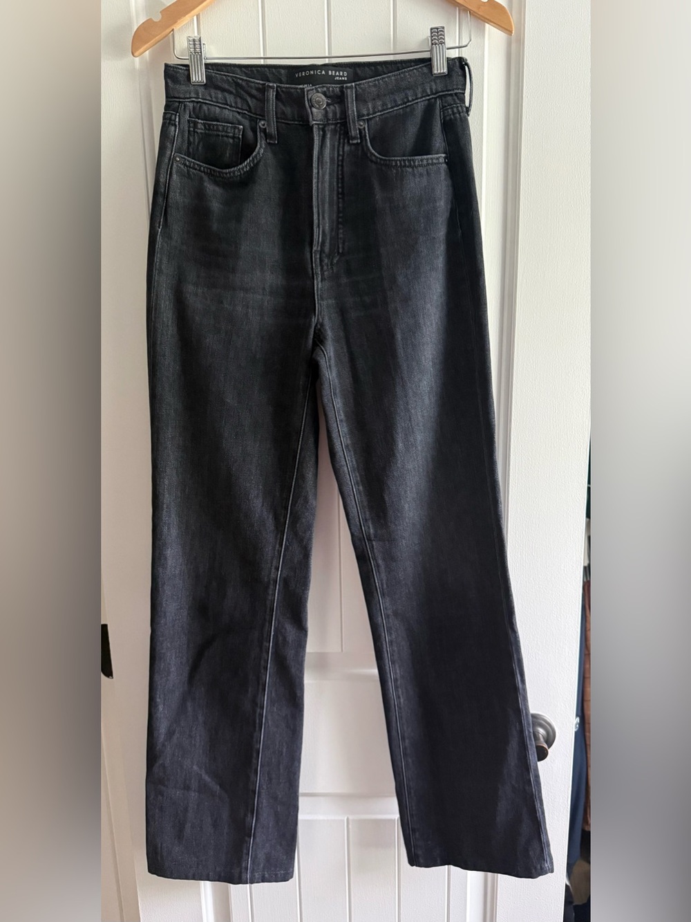 Veronica Beard black high-rise straight-leg jeans.